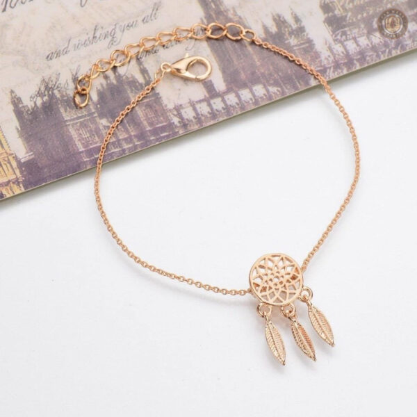 Bijou en forme d'attrape-rêves, inspiration western